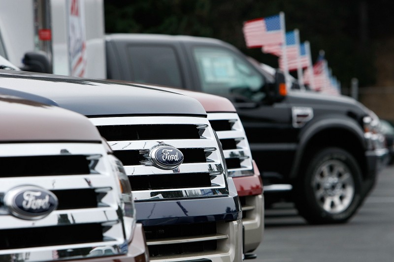 COLMA, CA - SEPTEMBER 04:  A row of new Ford trucks are displayed at a Ford dealership September 4, 2007 in Colma, California. Ford Motor reported a 14 percent decline in August sales of cars and trucks in the U.S. on Augday as fuel prices continue to rise and the housing market weakens.   (Photo by Justin Sullivan/Getty Images)